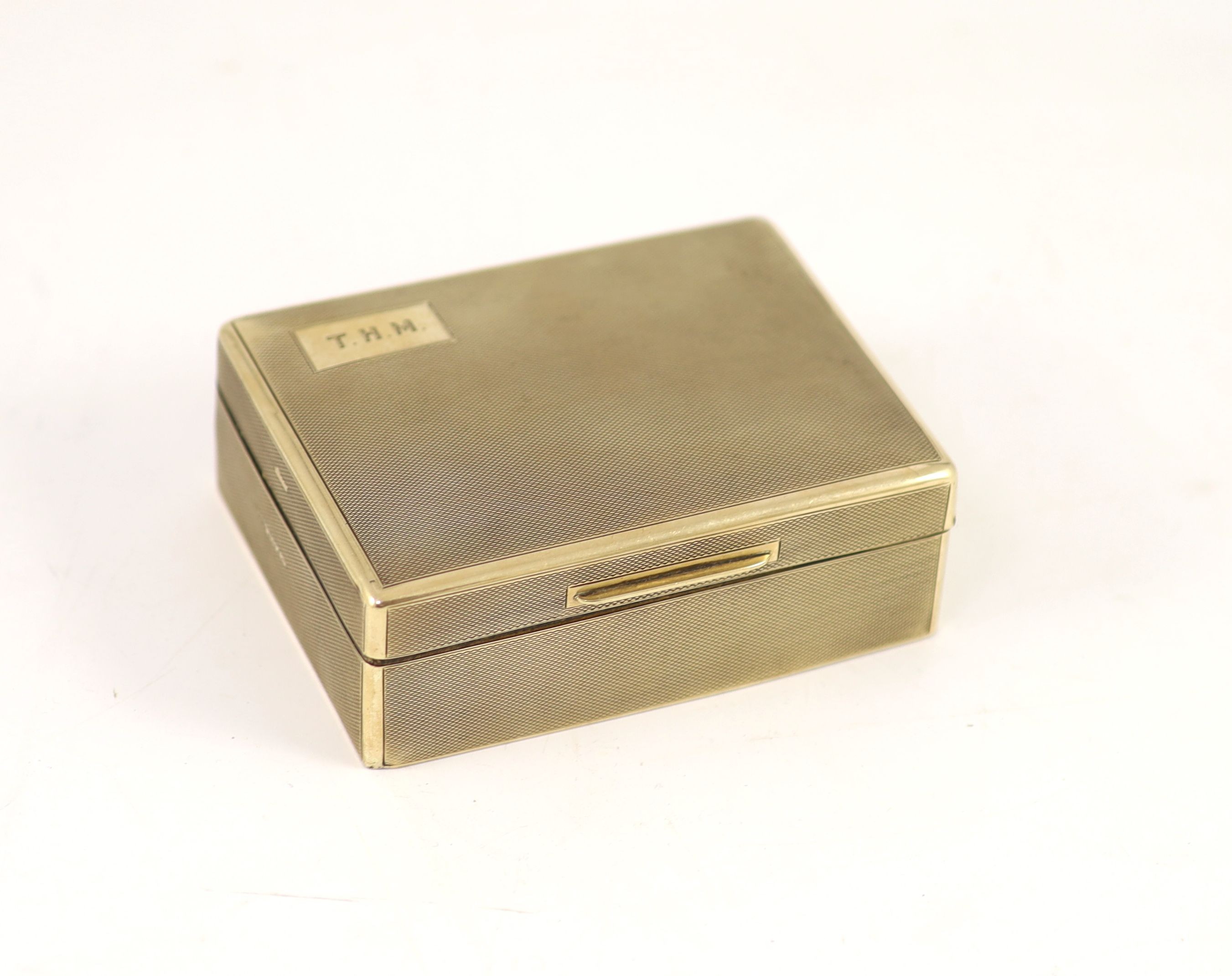 A late 1920's George V engine turned 9ct gold rectangular cigarette box, by Saunders & Shepherd